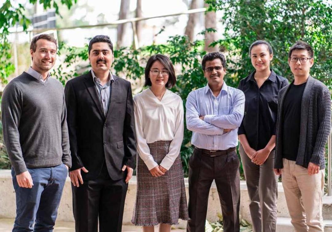 Three Minute Thesis participants standing together. 