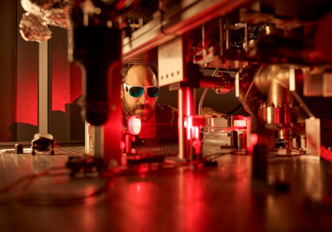 A man works with laser micromanipulation
