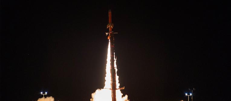 A HIFiRE4 hypersonic test, with the rocket launching into the night sky.