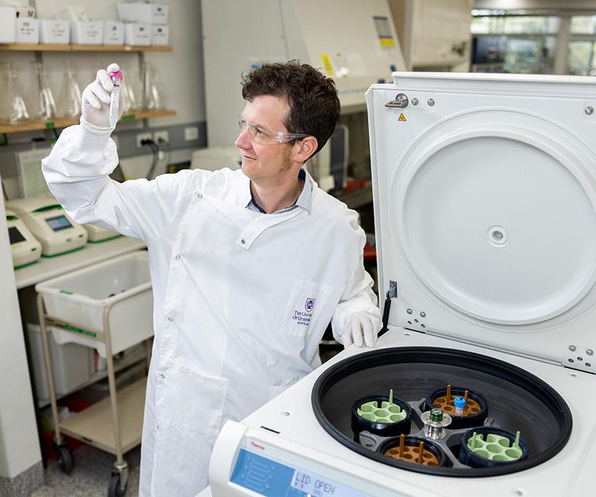 Associate Professor Keith Chappell using a centrifuge