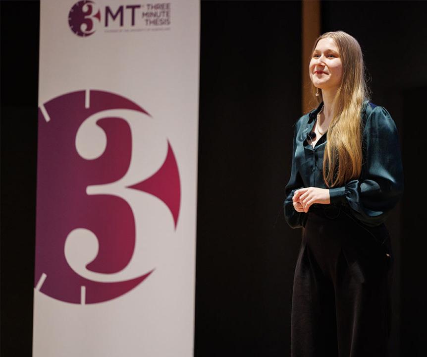 Three Minute Thesis winner Emily Cooper presenting her thesis.