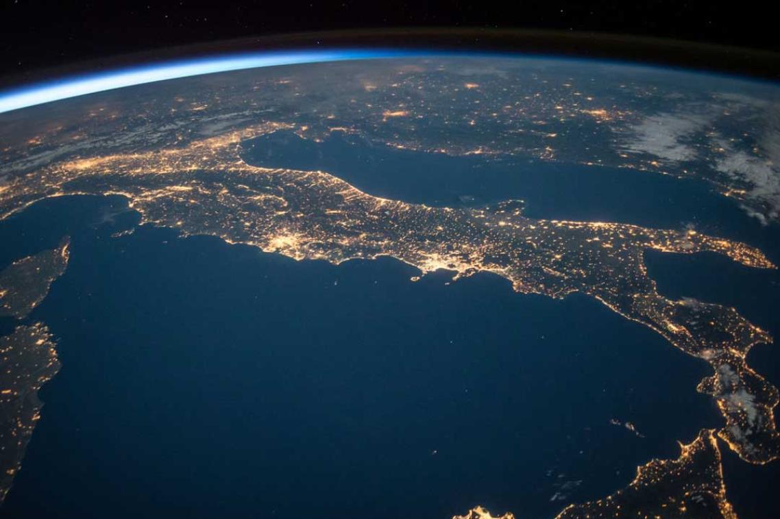 Aerial view of the earth from space with lights sparkling over Europe