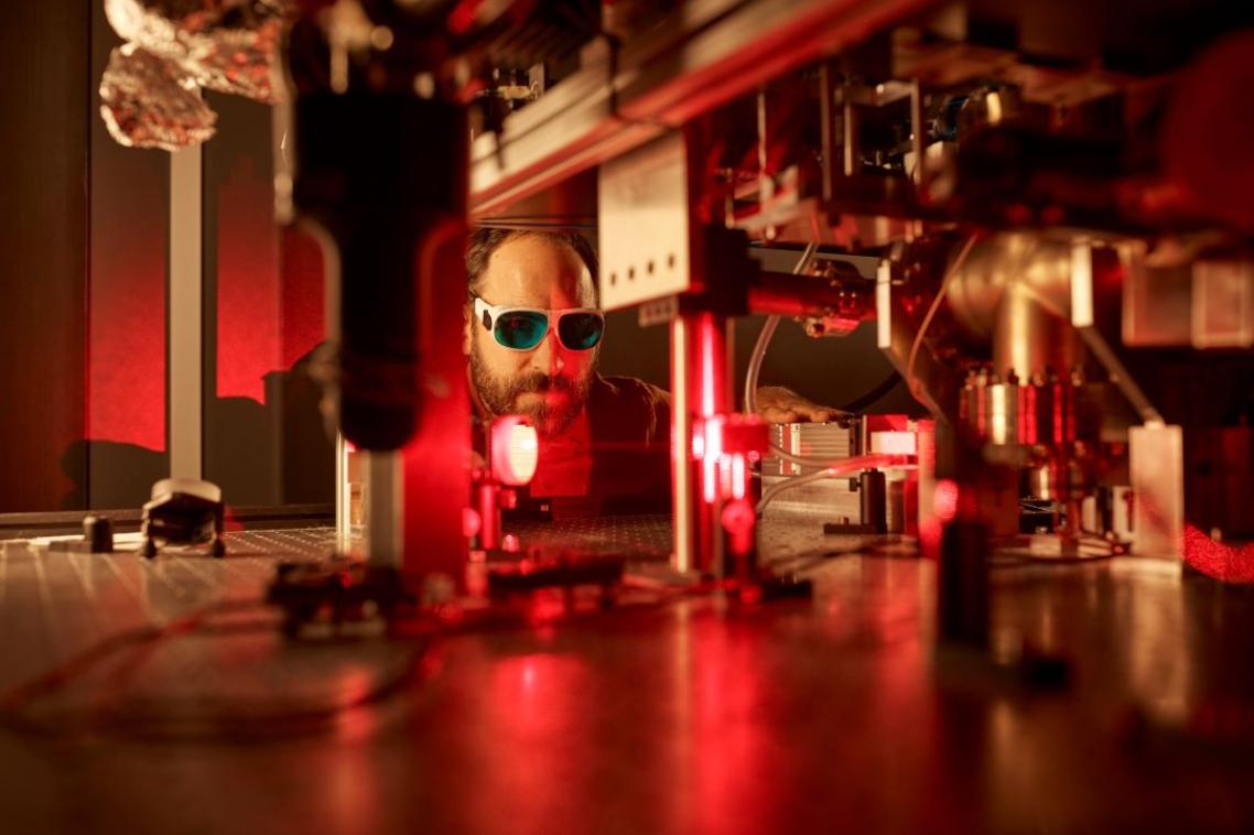 A man works with laser micromanipulation