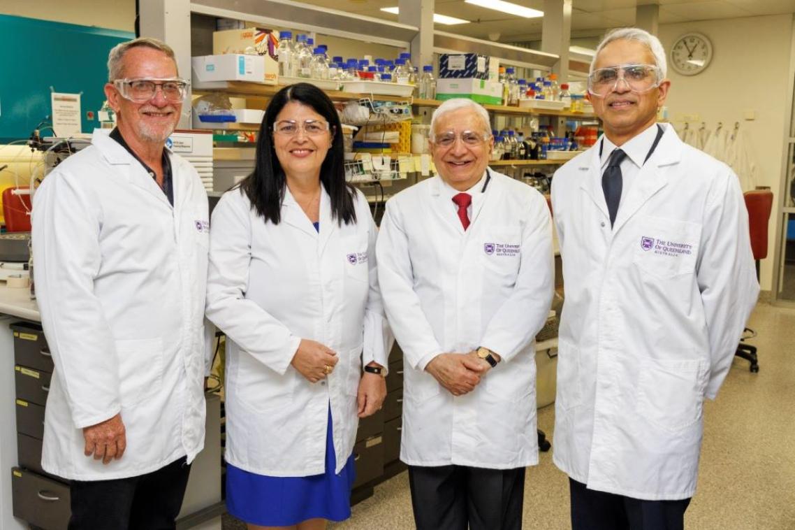 Government, industry and academic representatives in lab coats at the announcement of the Queensland Emory Vaccine Centre